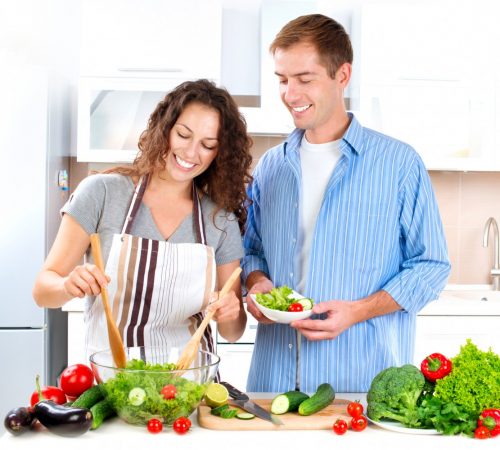 Couple fixing a salad