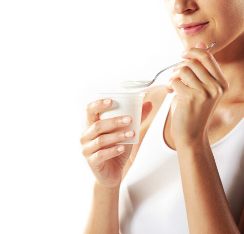 Woman eating yogurt